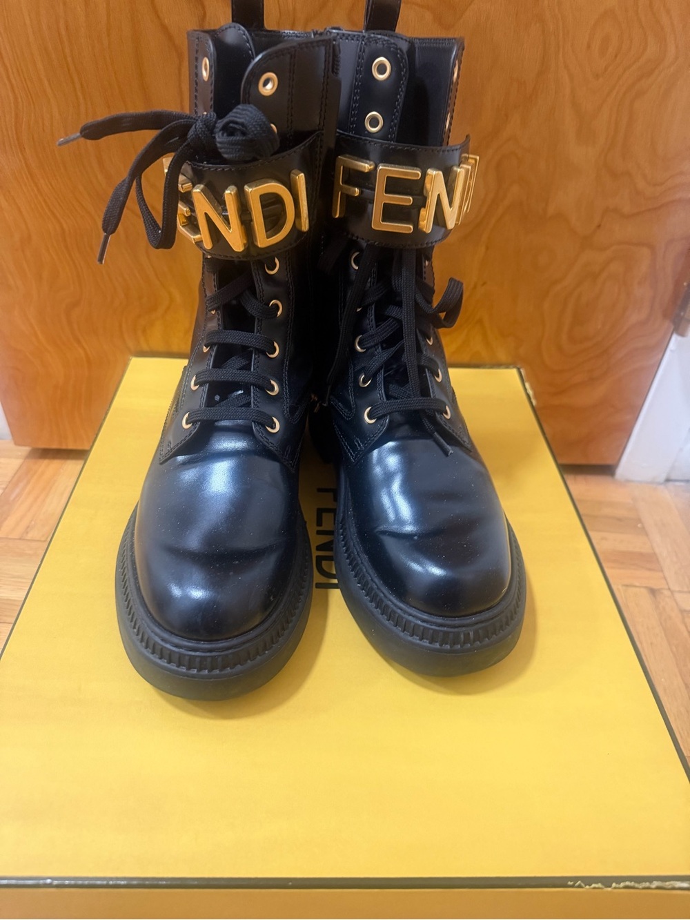 Fendi Black Leather Combat Boots with Gold Logo Strap
